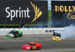 Ron Hornaday Jr. (No. 33) makes contact with Johnny Sauter and both slide in Turn 4 with 10 laps to go in the NASCAR Camping World Truck Series O'Reilly Auto Parts 250 at Kansas Speedway on May 2, 2010 in Kansas City, Kan. Credit: Rick Dole/Getty Images